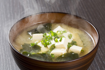 A bowl of traditional Japanese miso soup with tofu and seaweed